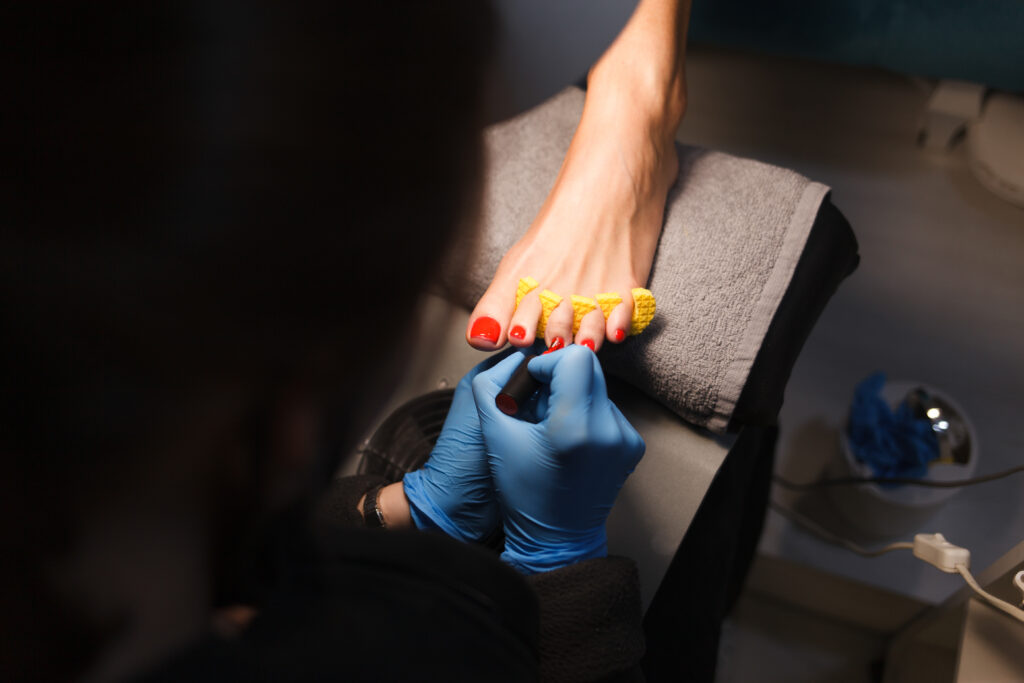 Master does pedicure for client. Pedicure process.